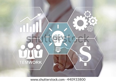 Business, finance, technology and internet concept - businesswoman pressing lightbulb button on virtual screens. Ideas in business. Brainstorm. Business community. Designed in the style of a hexagon.