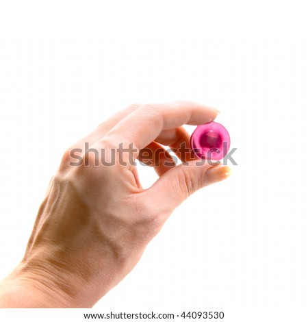 Old human hand with button isolated on white