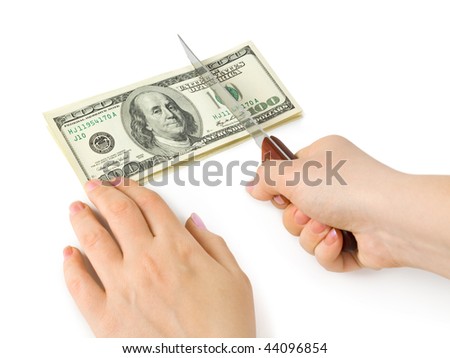 Hands with knife cutting money isolated on white background