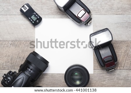Photographer's equipment on the floor in a room with copy space.