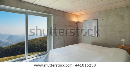 Interior of a modern chalet in cement, bedroom