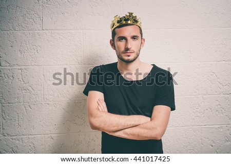 Portrait of a Man with a crown on his head folded his arms