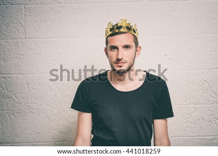Portrait of a Man with a crown on his head in the studio