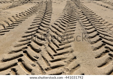 tire tracks in the sand as background