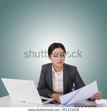 Worried business woman of Asian using laptop on desk, closeup portrait.