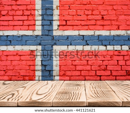 Norway flag painted on brick wall with wooden floor