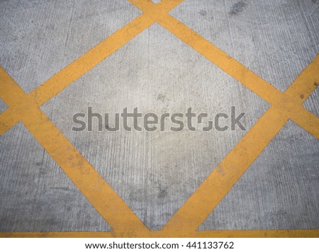 Surface of Yellow diagonal grid line on the concrete street/road. background texture