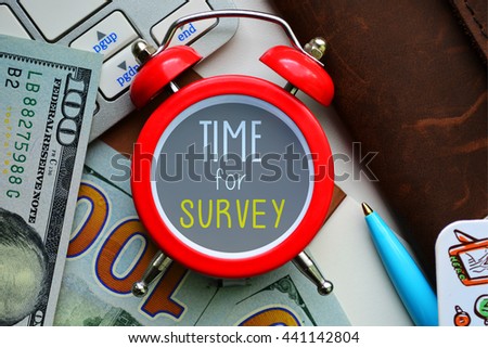 Time for survey. Sign on red clocks with cash and coins on background