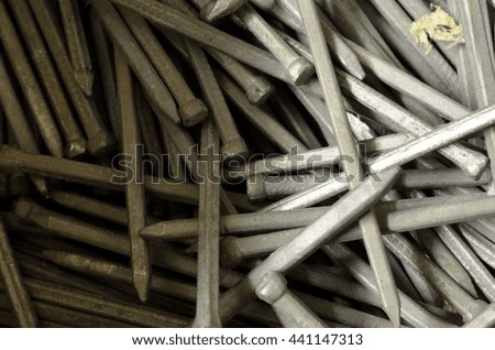 metal wood nail in pile in workshop macro photo