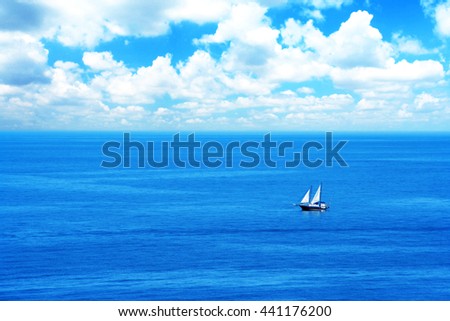 Beautiful calm morning sea summer landscape with a lone sailboat. Minimalism. Ideal background for tourism advertising