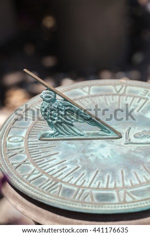 Old sun clock dial - Vintage sundial. Concept of time. Metal tool to measure time.