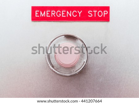 Emergency button on machine in factory.