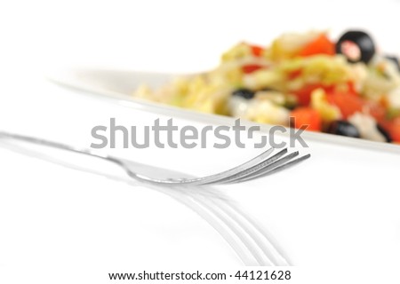 Tasty salad from vegetables on white plate