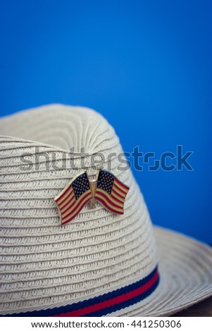 cowboy hat with flags of America, macro , vintage, independence day, blue background, copy space for text