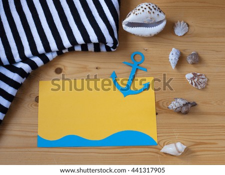 Congratulations on the day of the seafarer. Card with anchor, seashells on a wooden table