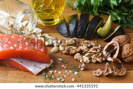 Omega 3 healthy fats on butchers block  Royalty-Free Stock Photo #441335191