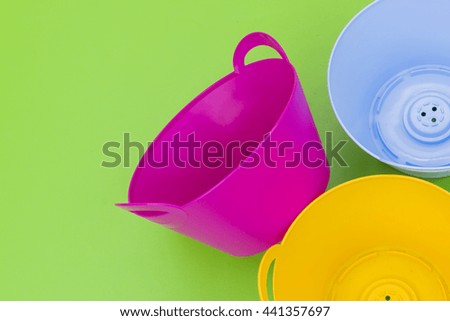 colorful plastic flower pots and leave space for adding your content. 