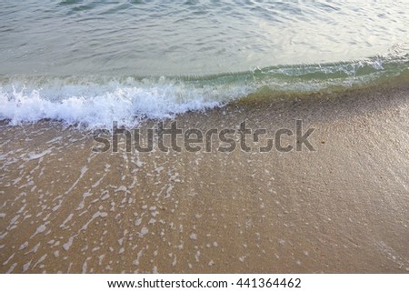 clear water,wave and wet sand at beach:Close up,select focus with shallow depth of field:ideal use for background