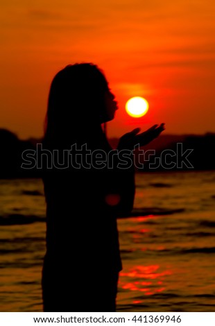Love concept : silhouettes of young girl with sunset