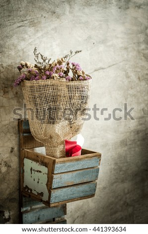 still life : dried flowers with stucco wall background - selective focus