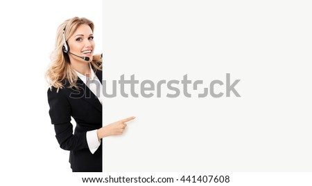 Portrait of support phone operator in headset showing blank signboard with copyspace area for text or slogan, isolated against white background