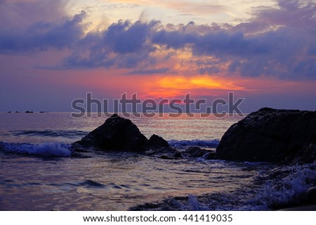 sunrise time at the sea withe silhouette little island and beach on foreground:select focus with shallow depth of field:ideal use for background
