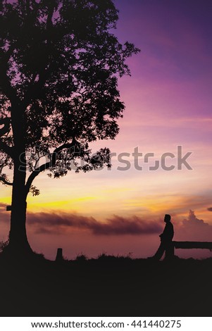 Beautiful silhouette tourist having fun at sunset time