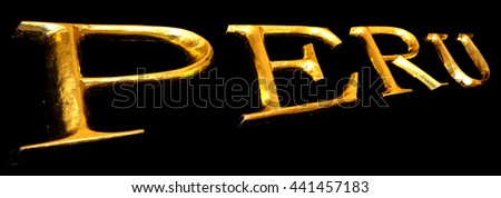 Wooden letters in gold on black background spelling PERU