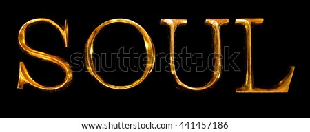 Wooden letters in gold on black background spelling SOUL
