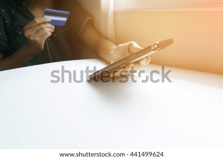 holding smart phone and credit card. Shopping Online , business online