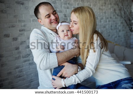 happy father and mother with baby