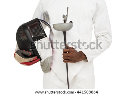 Mid-section of man standing with fencing mask and sword on white background