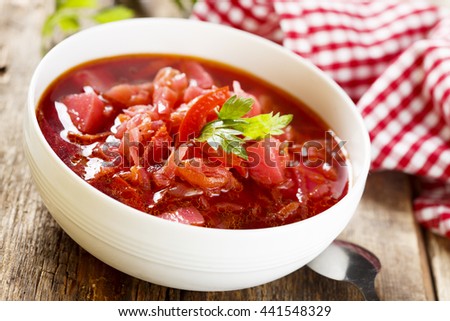 Beetroot soup in white bowl