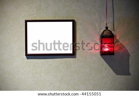 Grunge interior with frame and burning latern