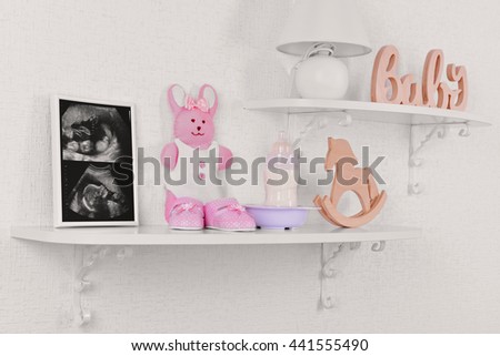 Photo frame with ultrasound scan of baby and accessories on shelves close-up