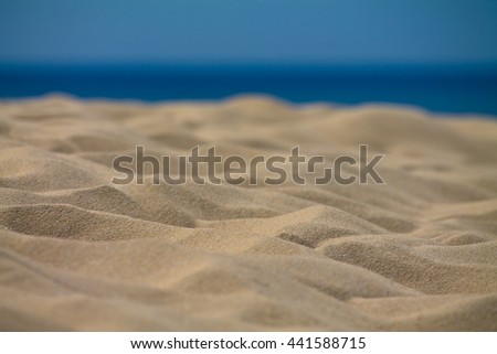 close-up of sandy beach with view on ocean