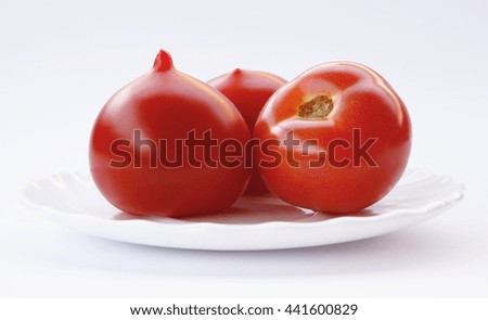 beautiful and juicy tomatoes on a white background photo for micro-stock