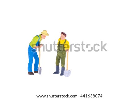 Close up of Miniature gardener people for housework and gradening concept isolate on white background.