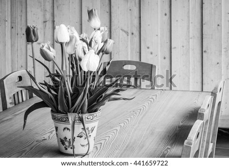 flower at an old table and chair