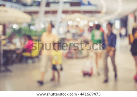 Abstract blurred image of people in shopping mall with bokeh. Retro and vintage style