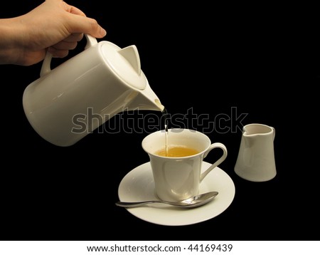 A picture of a person pouring tea isolated on a black background. A flask of honey is included.