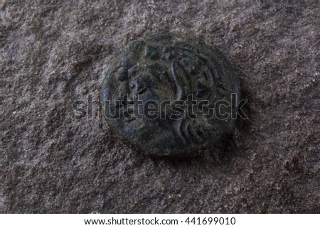 Ancient Greek copper coin with satyr