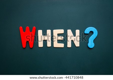 Text 'when' wording on blackboard - business concept of 5 WHs questions - problem solving - colorful alphabet made from wood