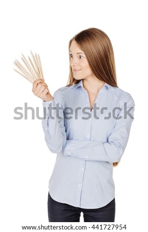woman choosing from pencils. isolated on white background