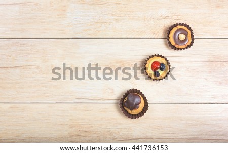 Pictured pastries on light wood background,above view with copy space.