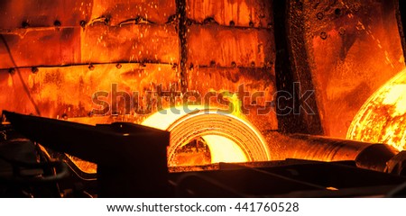 Roll of hot metal on the conveyor belt Royalty-Free Stock Photo #441760528