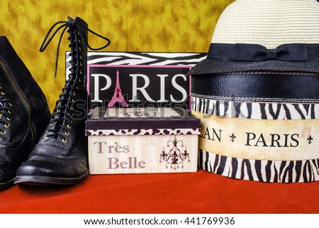 Paris France sign French boxes hat and boots on red and gold background