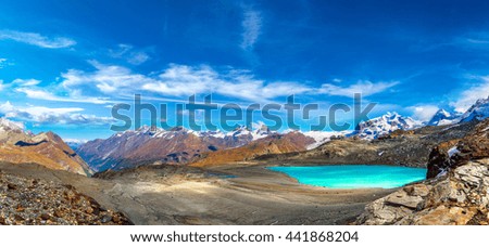 Alps mountain landscape and mountain lake in a beautiful day in Switzerland