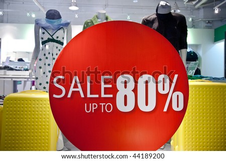 Sale sign on the clothes shop window. Shopping collection.