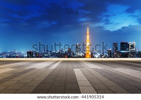cityscape and skyline of tokyo at twilight on view from empty street